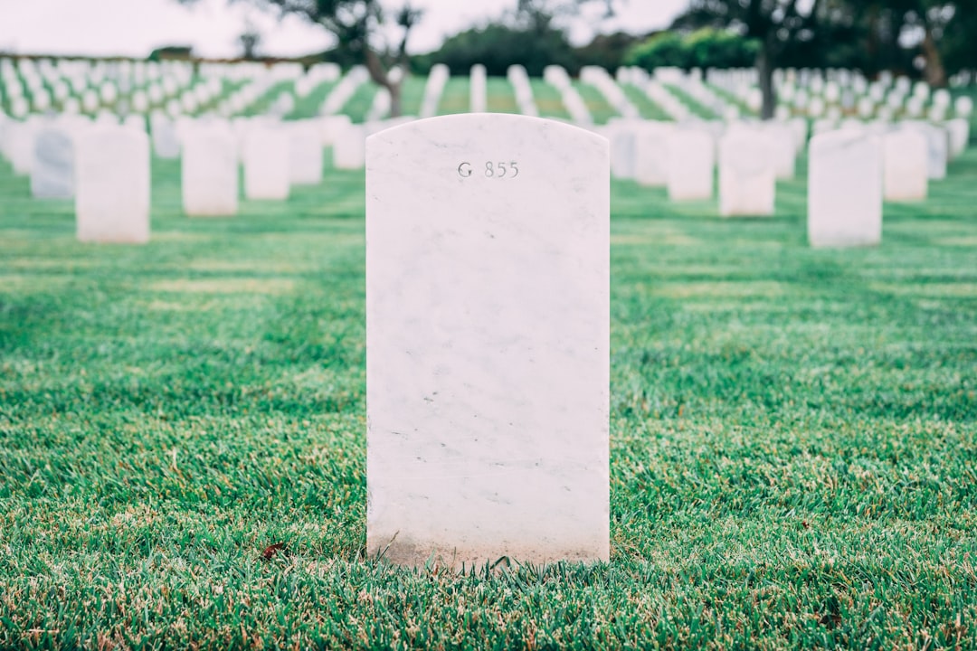 Peaceful cemetery with rows of headstones